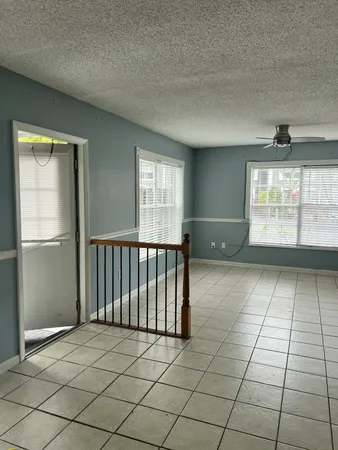 an empty room with windows