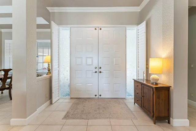 a view of a swimming pool with a garden and deck