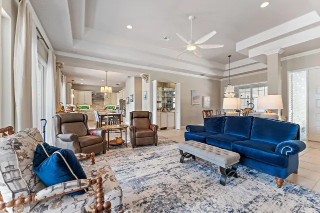 a view of an house with backyard porch and sitting area