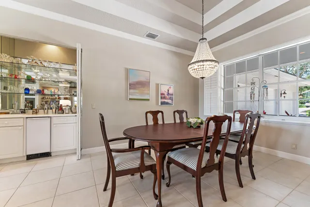 a room that has a table and a bookshelf
