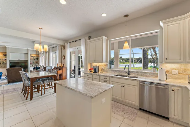 a bathroom with a double vanity sink toilet mirror and shower