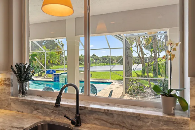 a spacious bedroom with a bed and a window