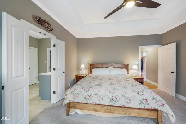 a bedroom with a bed and a table