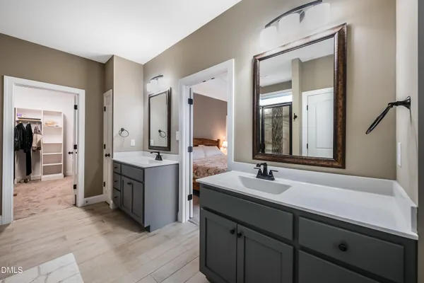 a spacious bathroom with a sink mirror and a bathtub