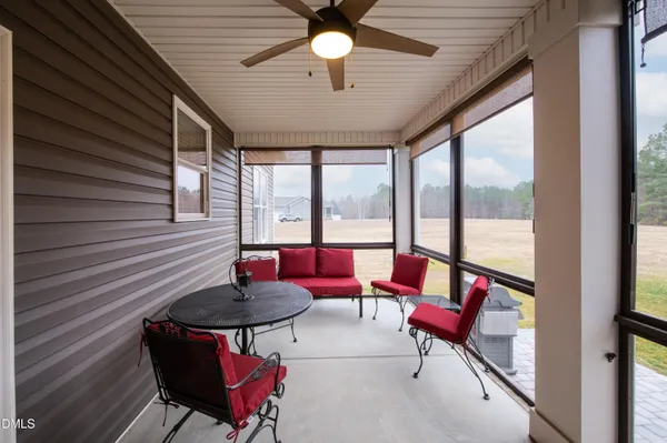 a playing room with furniture and a window