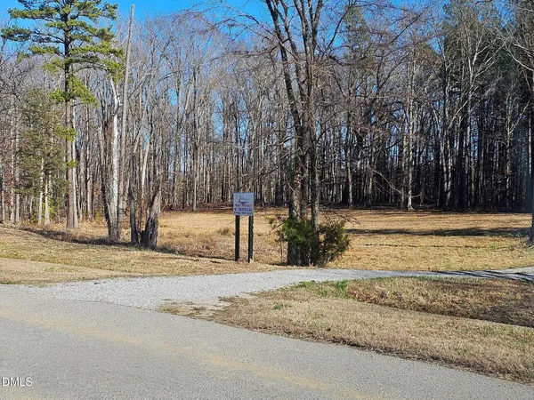 a view of a room with mountain view and wooden floor