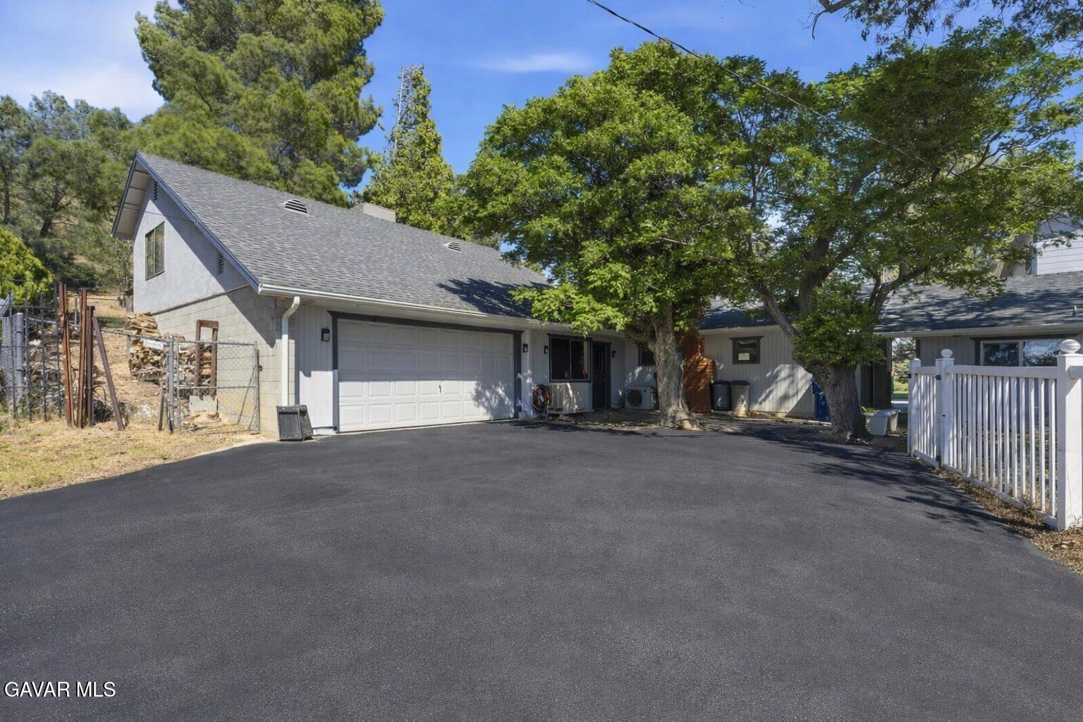 9065 Elizabeth Lake Road Leona Valley, CA 93551 - Photo 12 of 58 a view of a house with a outdoor space