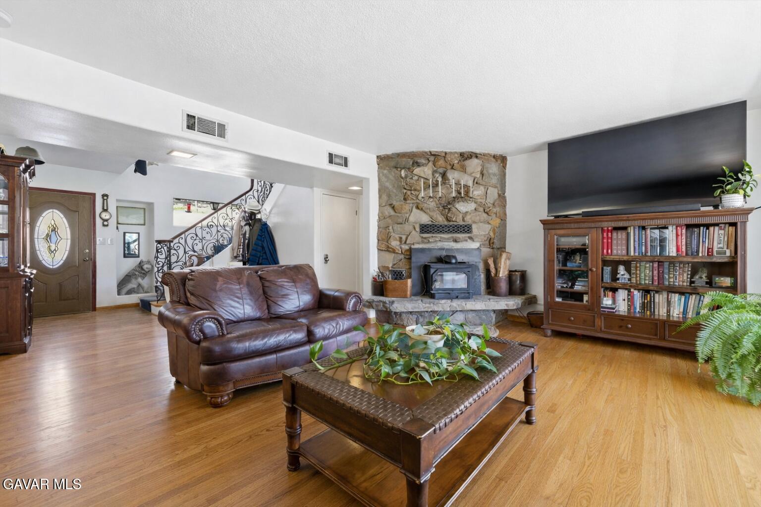 9065 Elizabeth Lake Road Leona Valley, CA 93551 - Photo 17 of 58 a living room with furniture and a flat screen tv