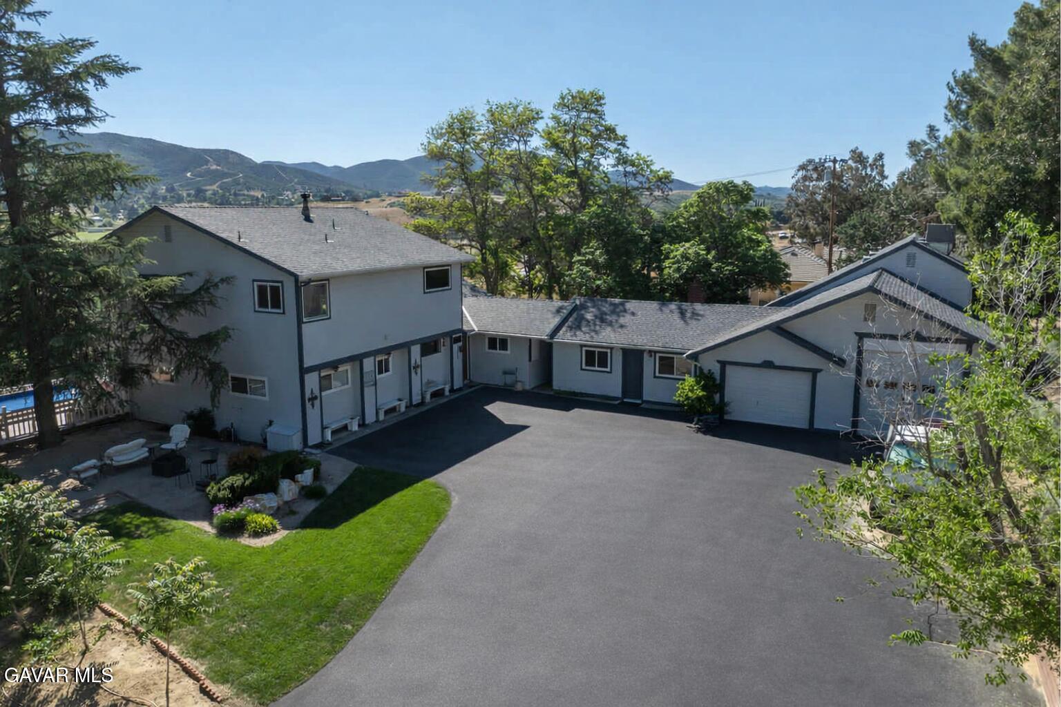 9065 Elizabeth Lake Road Leona Valley, CA 93551 - Photo 2 of 58 front view of a house with a yard