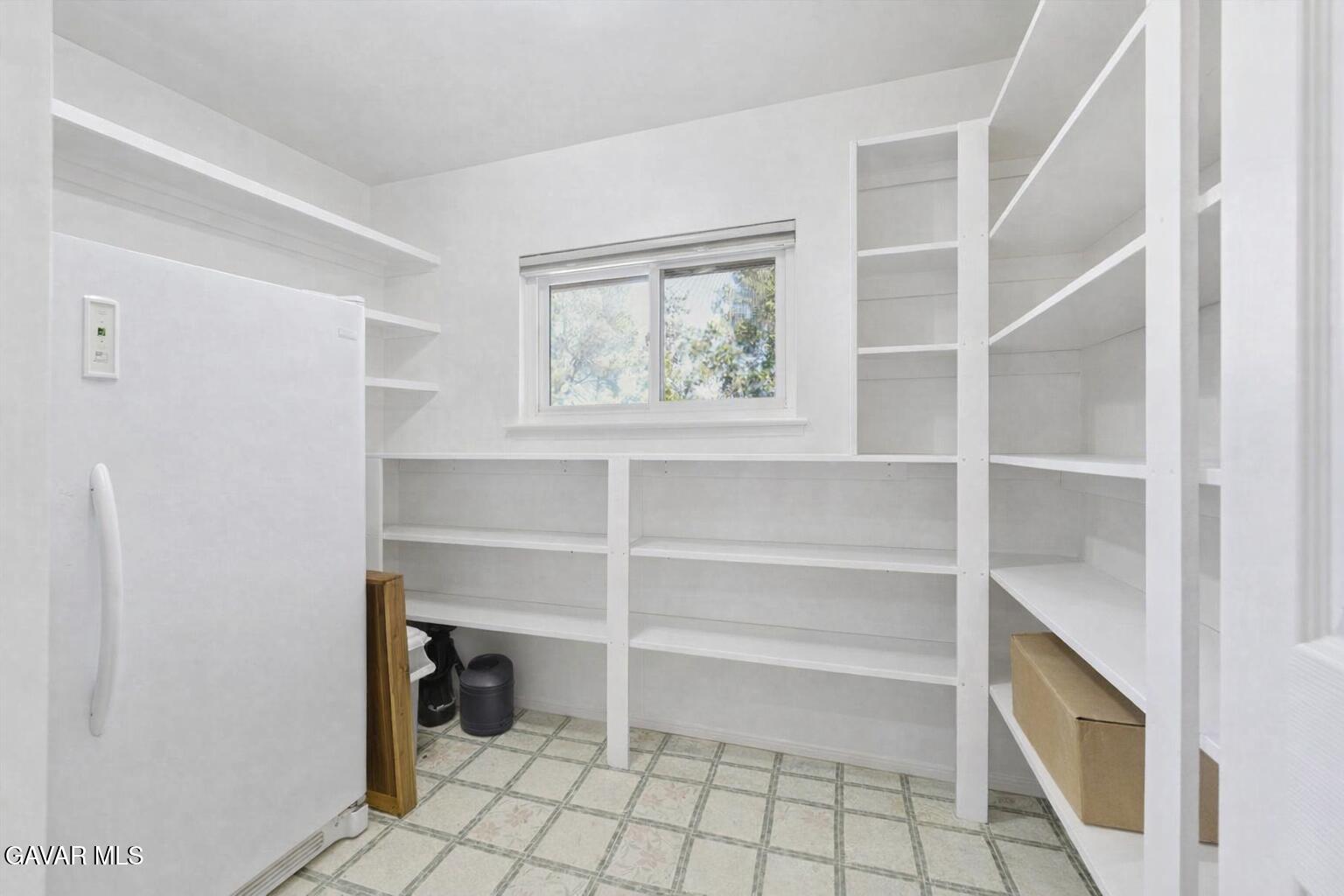 9065 Elizabeth Lake Road Leona Valley, CA 93551 - Photo 24 of 58 a view of an empty room with shelves