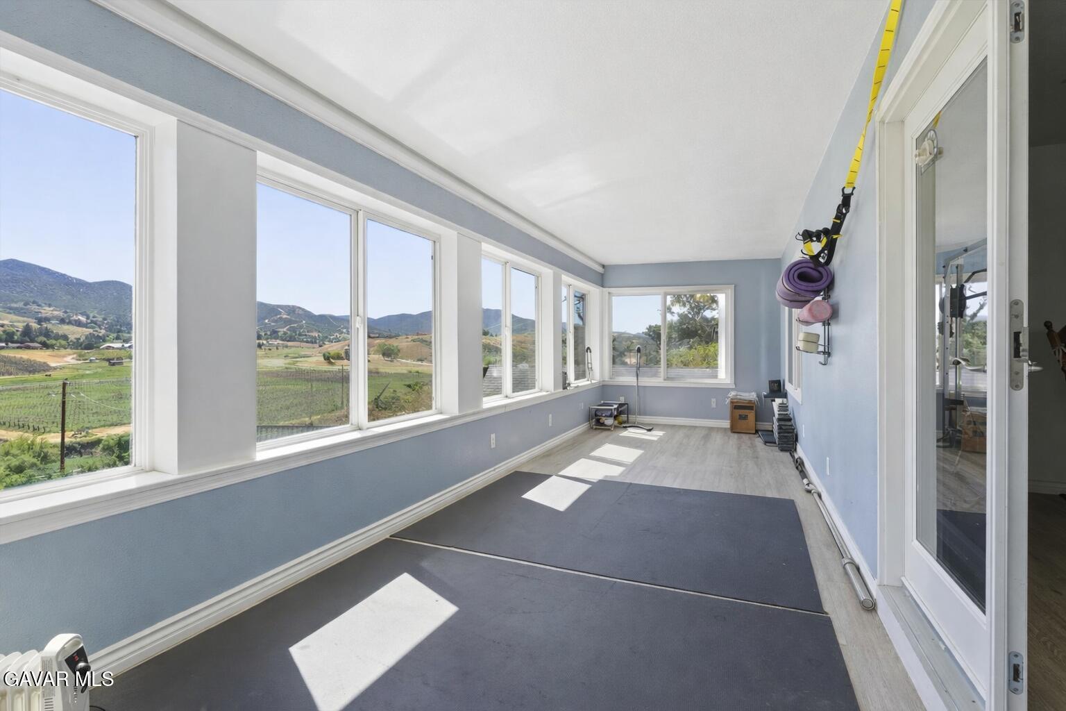 9065 Elizabeth Lake Road Leona Valley, CA 93551 - Photo 30 of 58 a view of living room with furniture and floor to ceiling window
