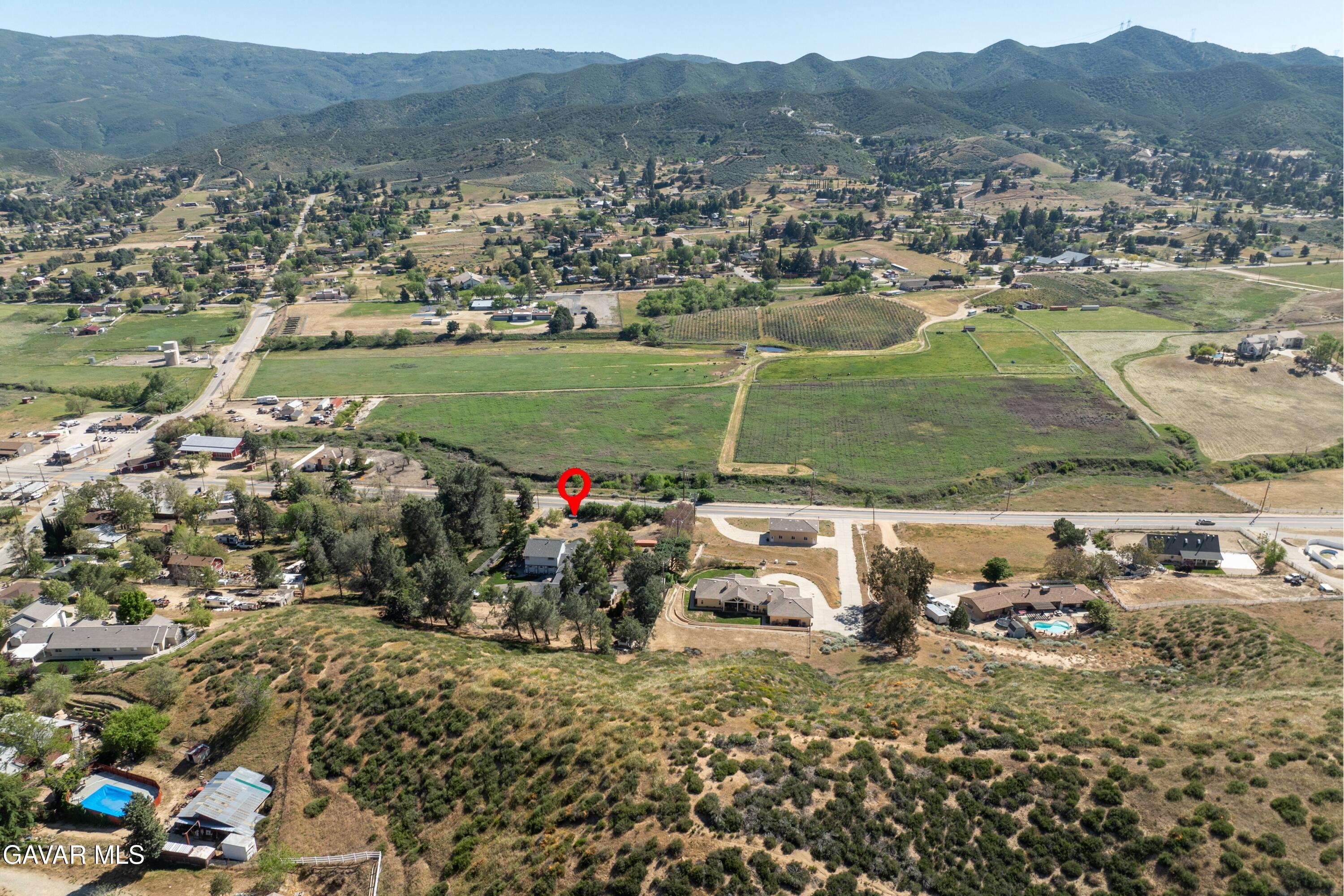 9065 Elizabeth Lake Road Leona Valley, CA 93551 - Photo 37 of 58 an aerial view of a houses with a yard and lake view
