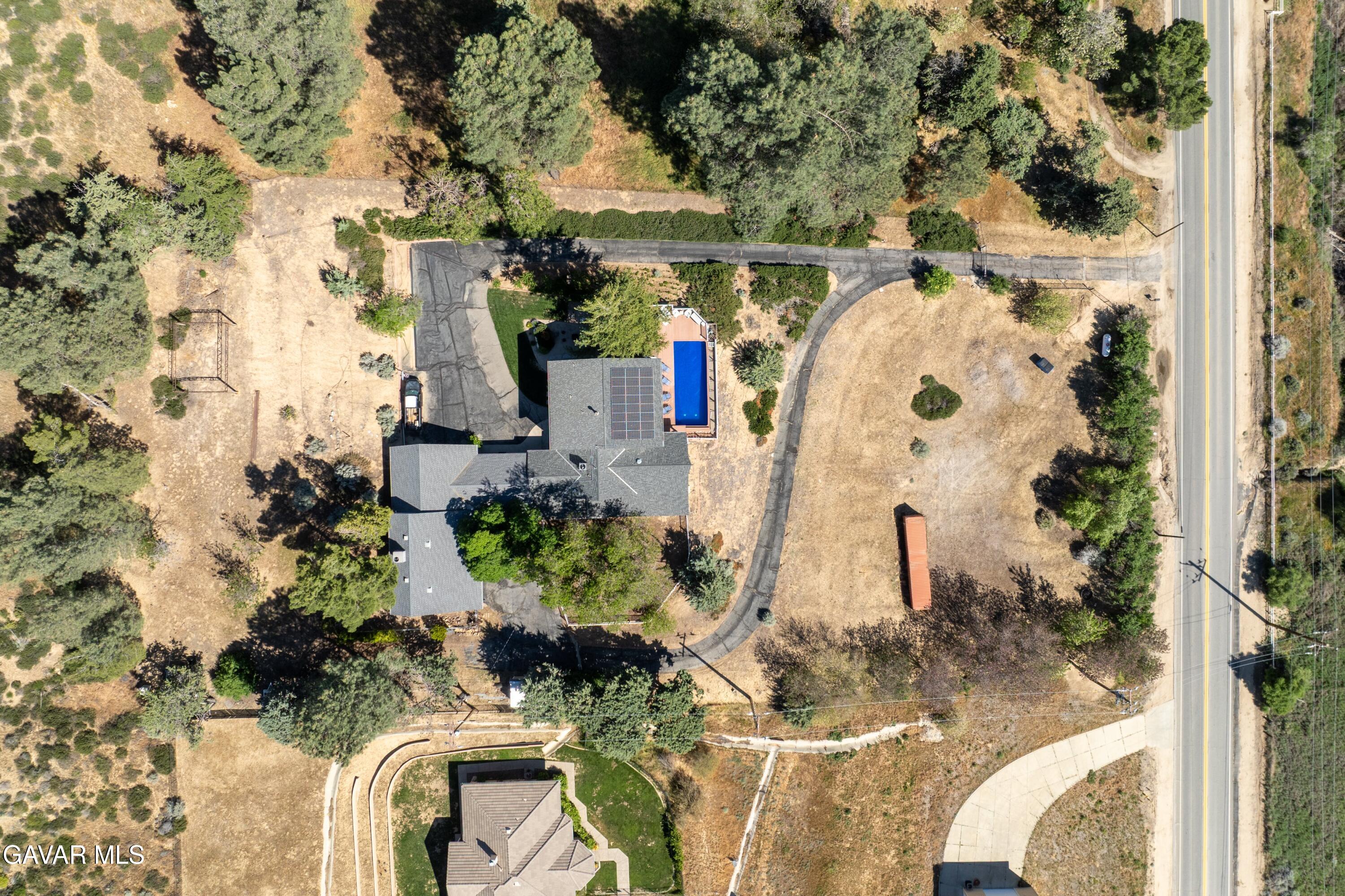 9065 Elizabeth Lake Road Leona Valley, CA 93551 - Photo 39 of 58 an aerial view of a house with a yard and fountain