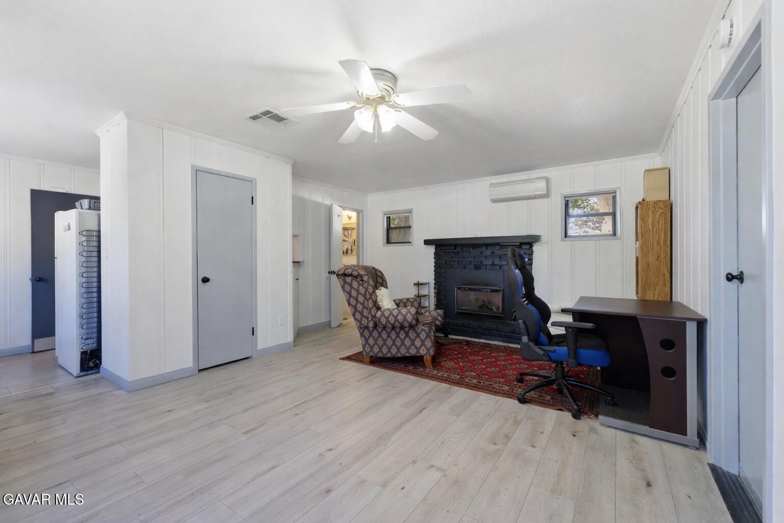 9065 Elizabeth Lake Road Leona Valley, CA 93551 - Photo 50 of 58 a living room with furniture and a fireplace