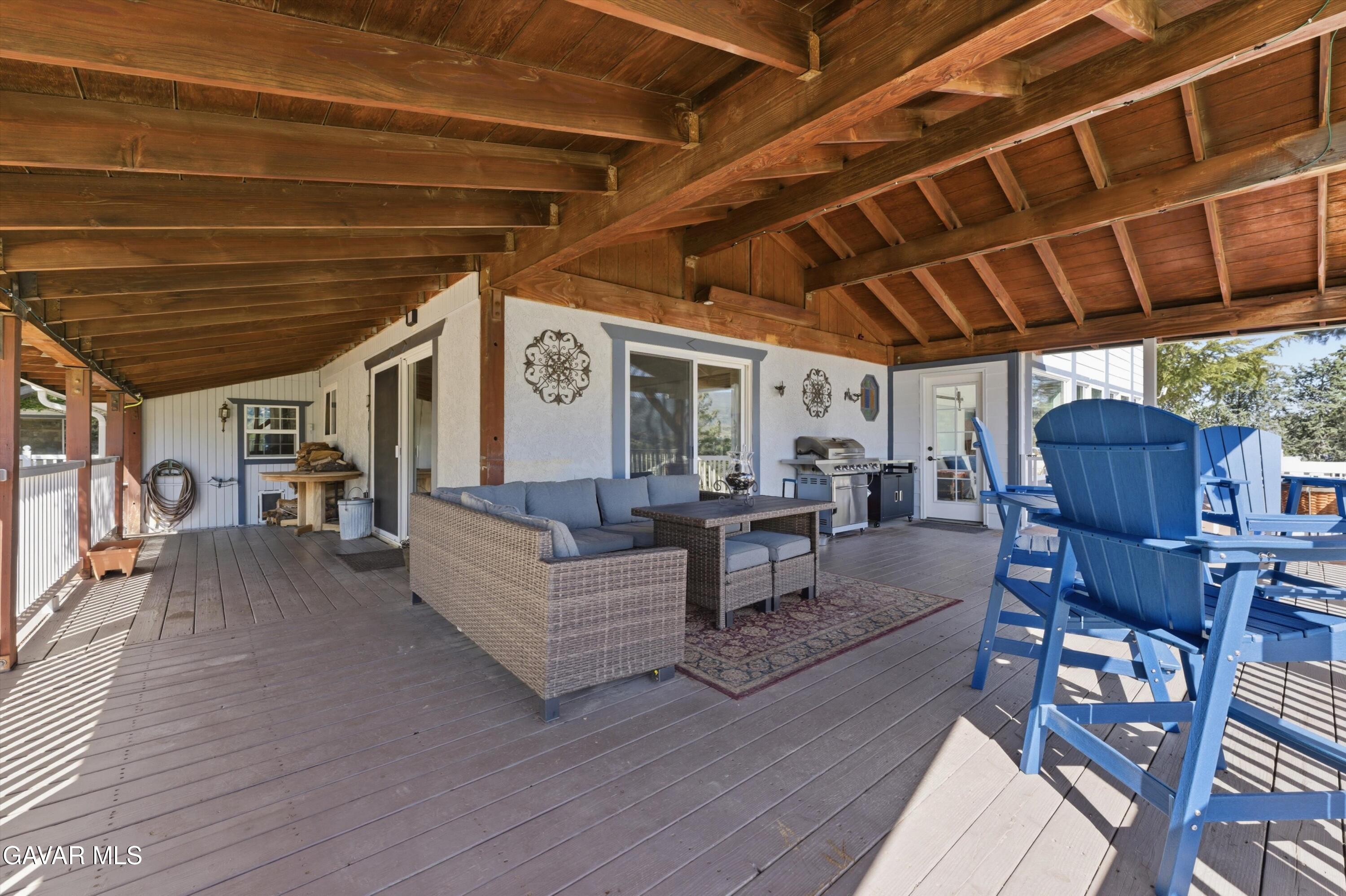 9065 Elizabeth Lake Road Leona Valley, CA 93551 - Photo 53 of 58 a living room with furniture and a wooden floor