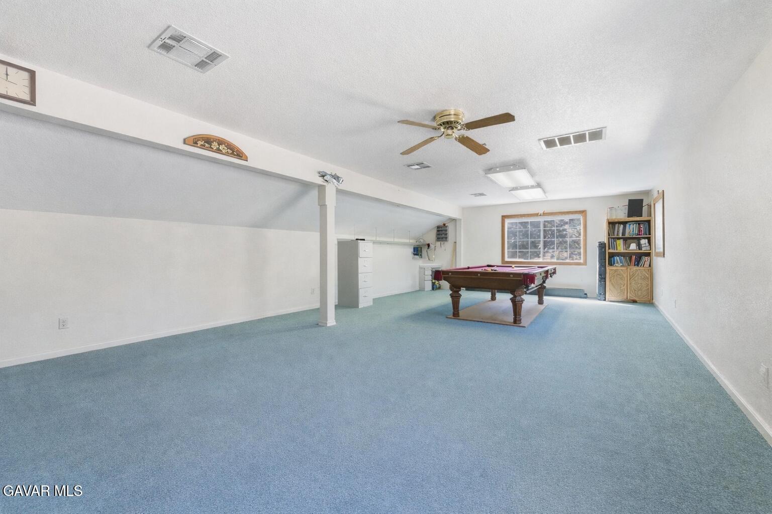9065 Elizabeth Lake Road Leona Valley, CA 93551 - Photo 58 of 58 a living room with furniture and a ceiling fan
