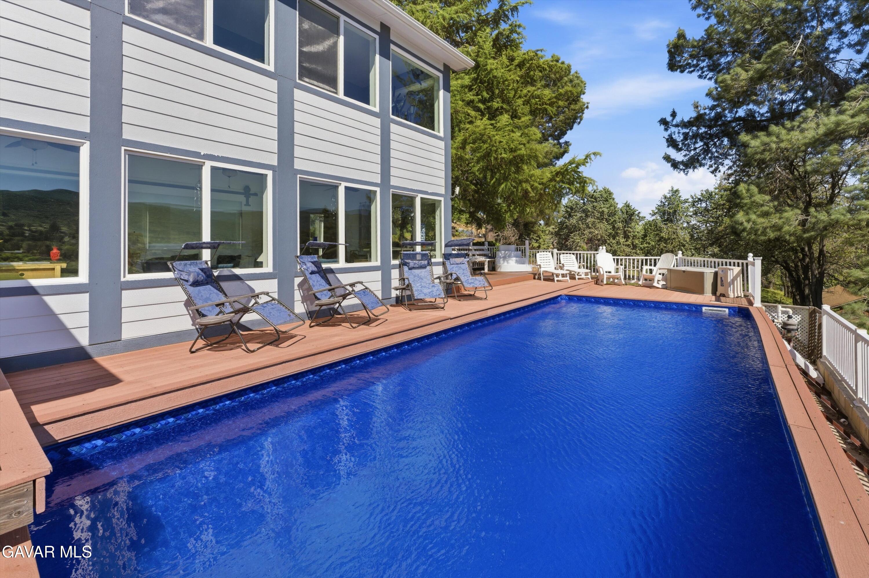 9065 Elizabeth Lake Road Leona Valley, CA 93551 - Photo 9 of 58 a view of a patio with swimming pool
