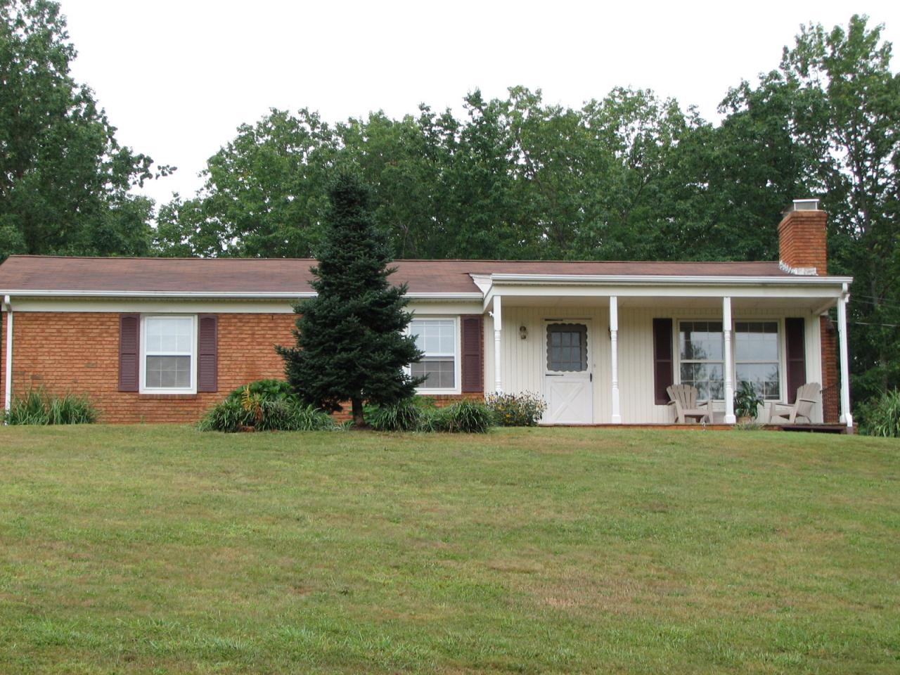 3401 Eton Road Hardy, VA 24101 - Photo 1 of 13 a front view of a house with a garden