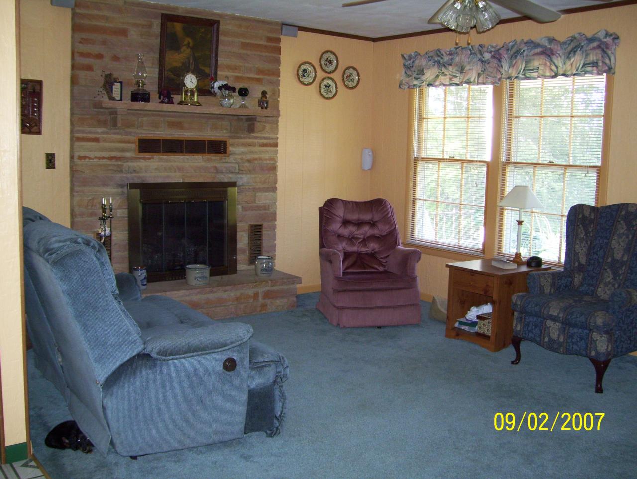 3401 Eton Road Hardy, VA 24101 - Photo 6 of 13 a living room with furniture and a fireplace