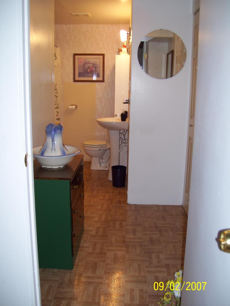 3401 Eton Road Hardy, VA 24101 - Photo 7 of 13 a bathroom with a sink and a mirror