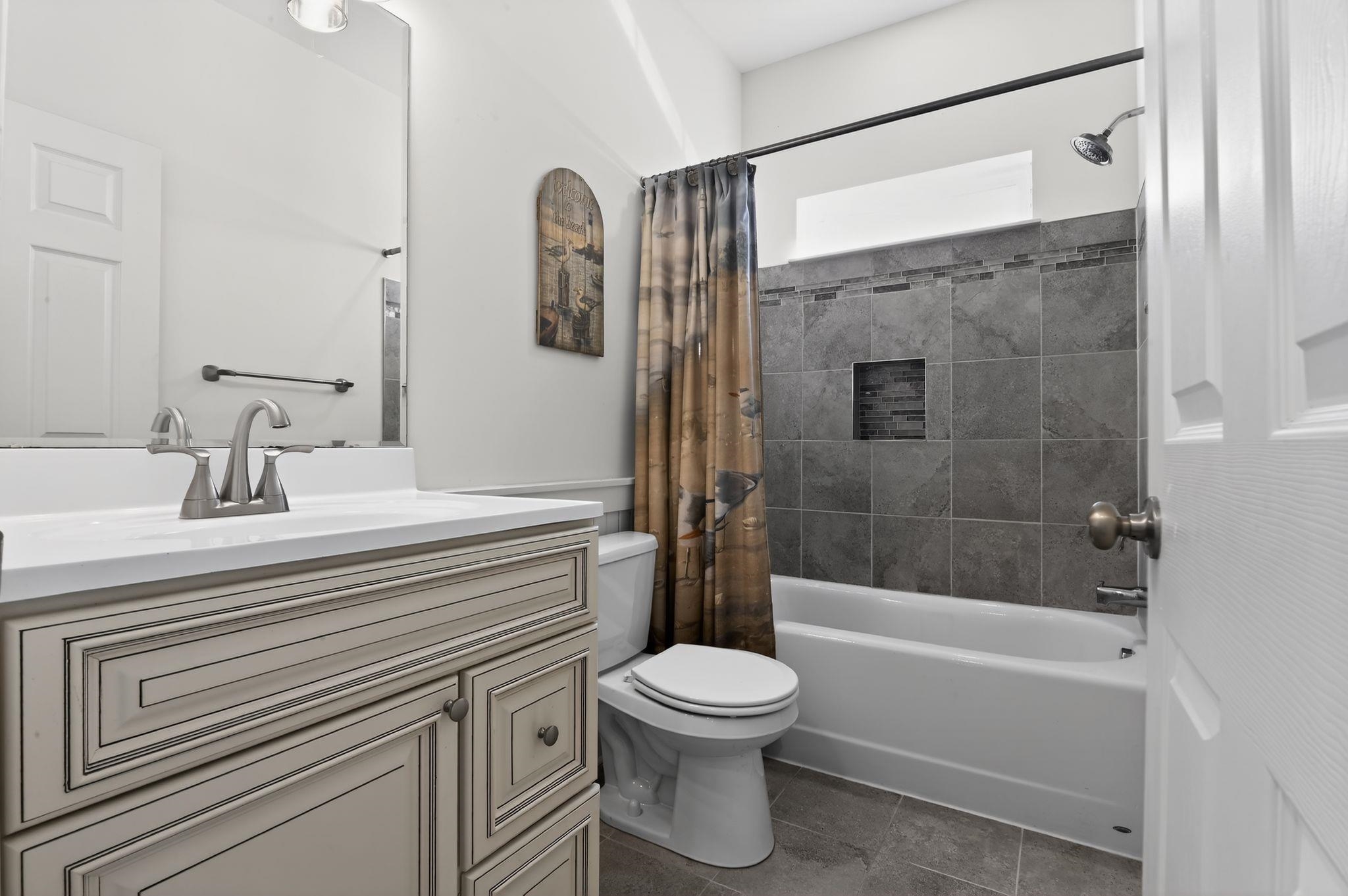 5 East Sumner Avenue Strathmere, NJ 08248 - Photo 14 of 35 a bathroom with a sink a toilet and shower