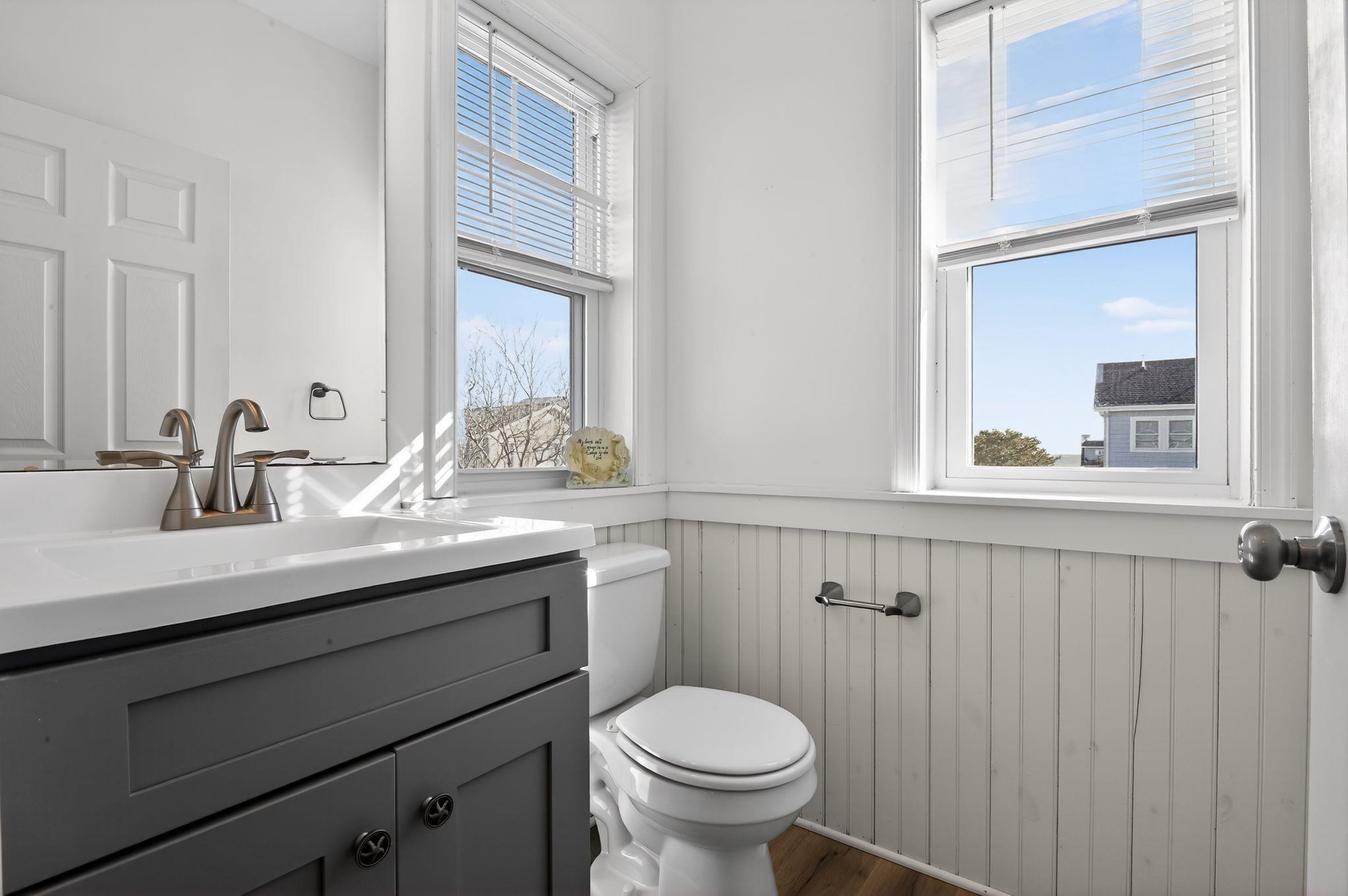5 East Sumner Avenue Strathmere, NJ 08248 - Photo 15 of 35 a bathroom with a sink a toilet and a mirror