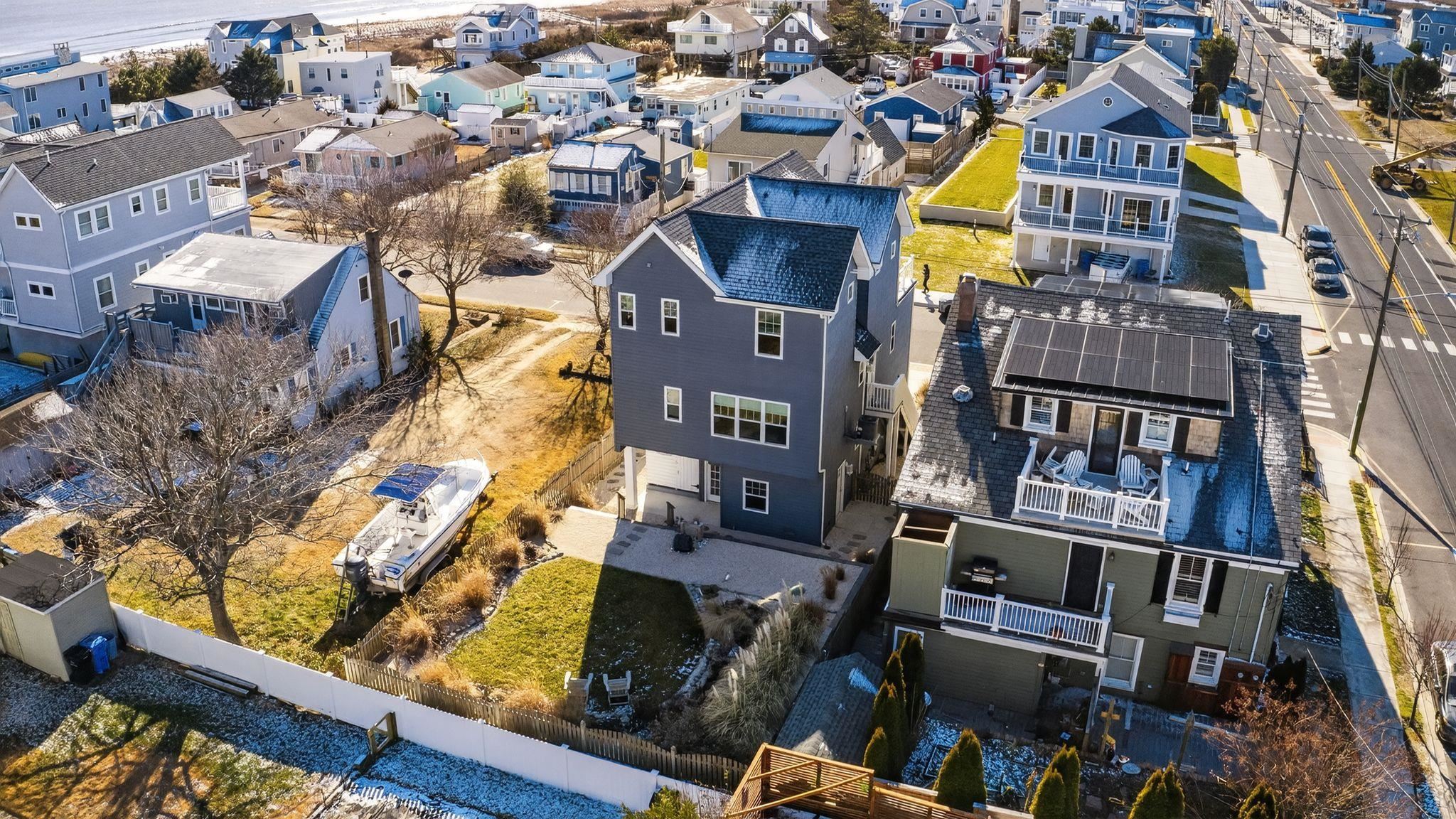 5 East Sumner Avenue Strathmere, NJ 08248 - Photo 32 of 35 an aerial view of a residential apartment building with a yard