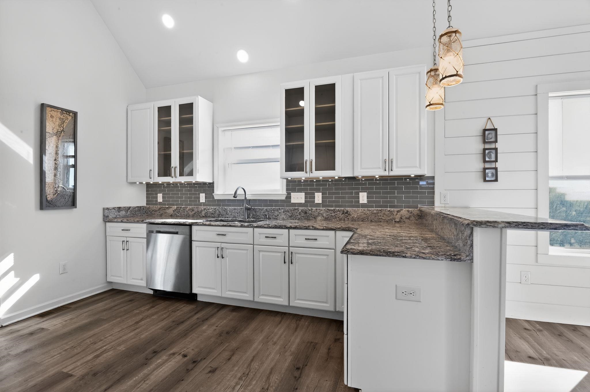 5 East Sumner Avenue Strathmere, NJ 08248 - Photo 7 of 35 a kitchen with granite countertop wooden cabinets and a sink