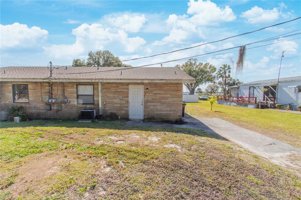 709 Mosley Road Lake Alfred, FL 33850 - Photo 1 of 17 a view of a house with swimming pool