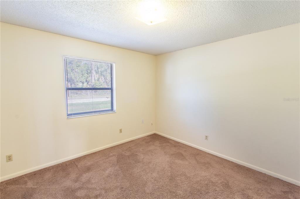 709 Mosley Road Lake Alfred, FL 33850 - Photo 12 of 17 an empty room with windows