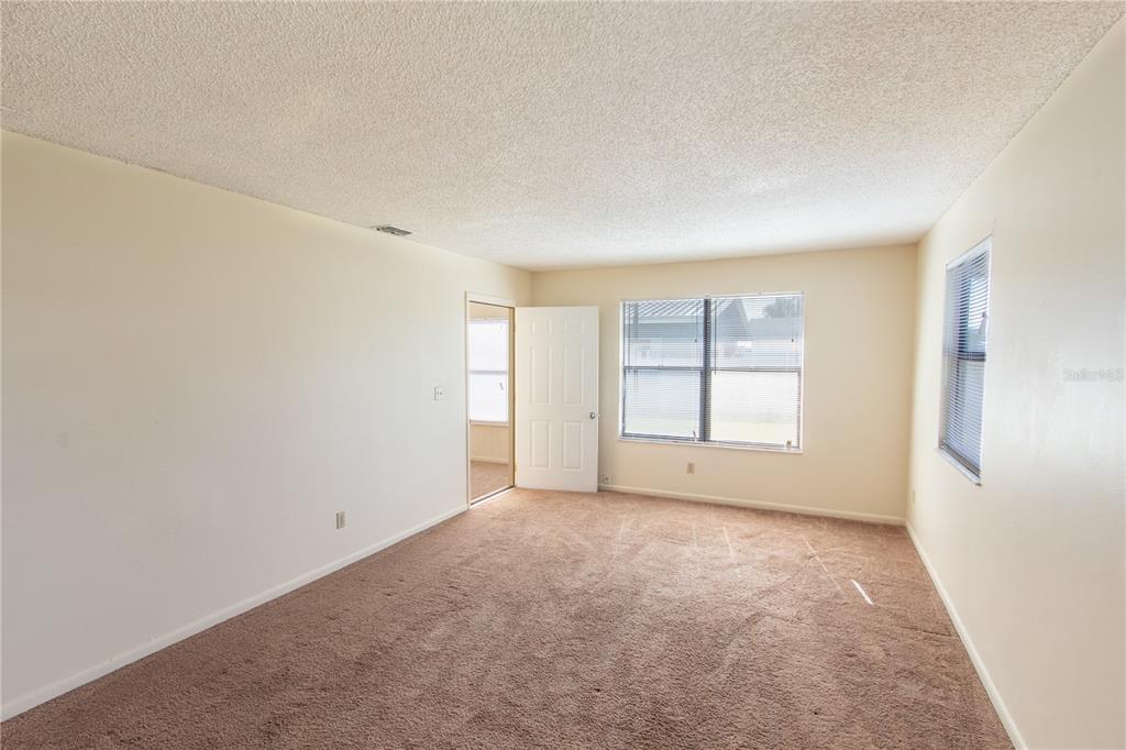 709 Mosley Road Lake Alfred, FL 33850 - Photo 4 of 17 an empty room with windows