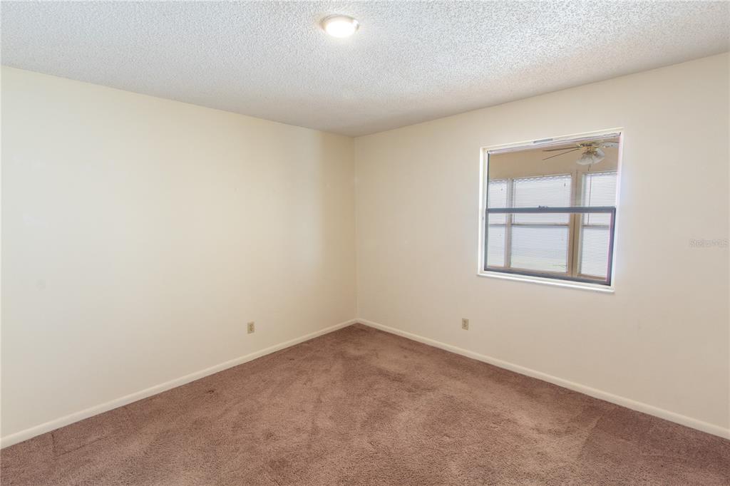 709 Mosley Road Lake Alfred, FL 33850 - Photo 9 of 17 an empty room with a window