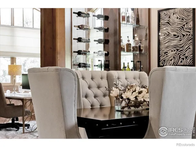a view of living room with furniture and a large window