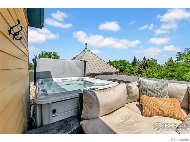 a front view of a house with swimming pool and furniture