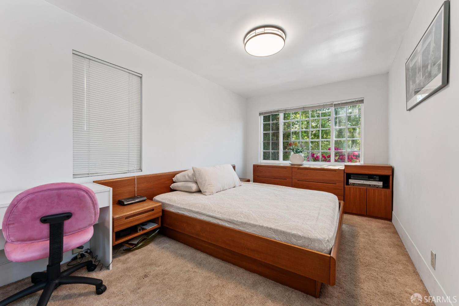 1109 Channing Way Berkeley, CA 94702 - Photo 11 of 24 a bedroom with a bed dresser and a windows