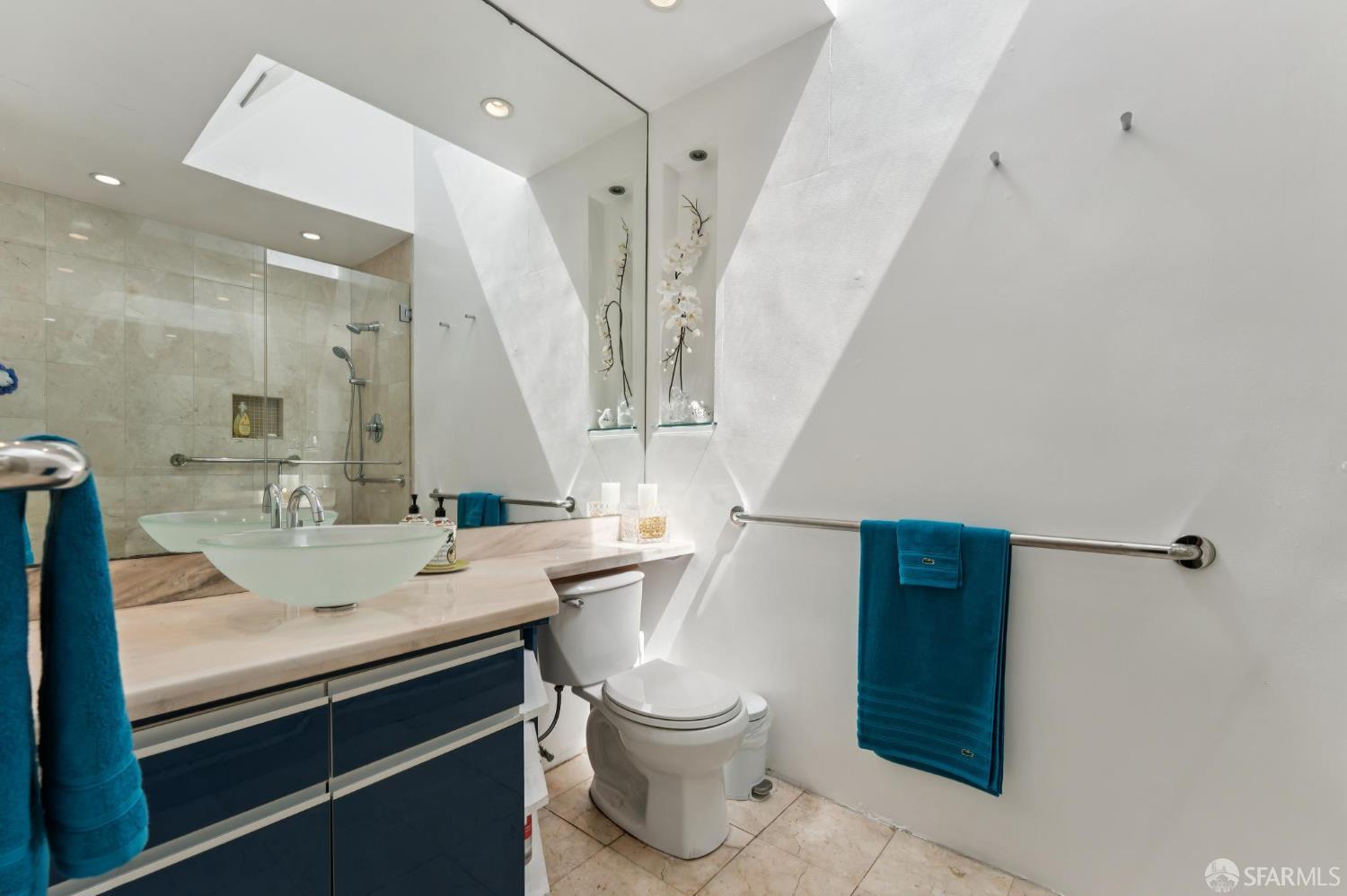 1109 Channing Way Berkeley, CA 94702 - Photo 12 of 24 a bathroom with a sink a toilet and a mirror