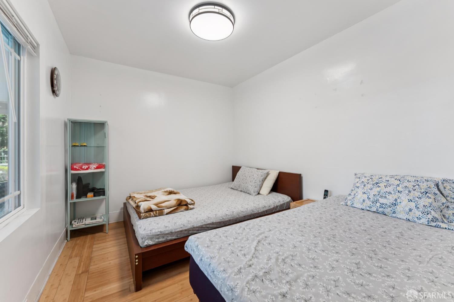 1109 Channing Way Berkeley, CA 94702 - Photo 14 of 24 a bedroom with a bed and a dresser