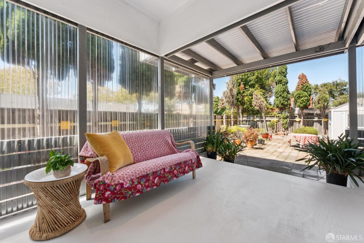 1109 Channing Way Berkeley, CA 94702 - Photo 17 of 24 a living room with furniture and a potted plant