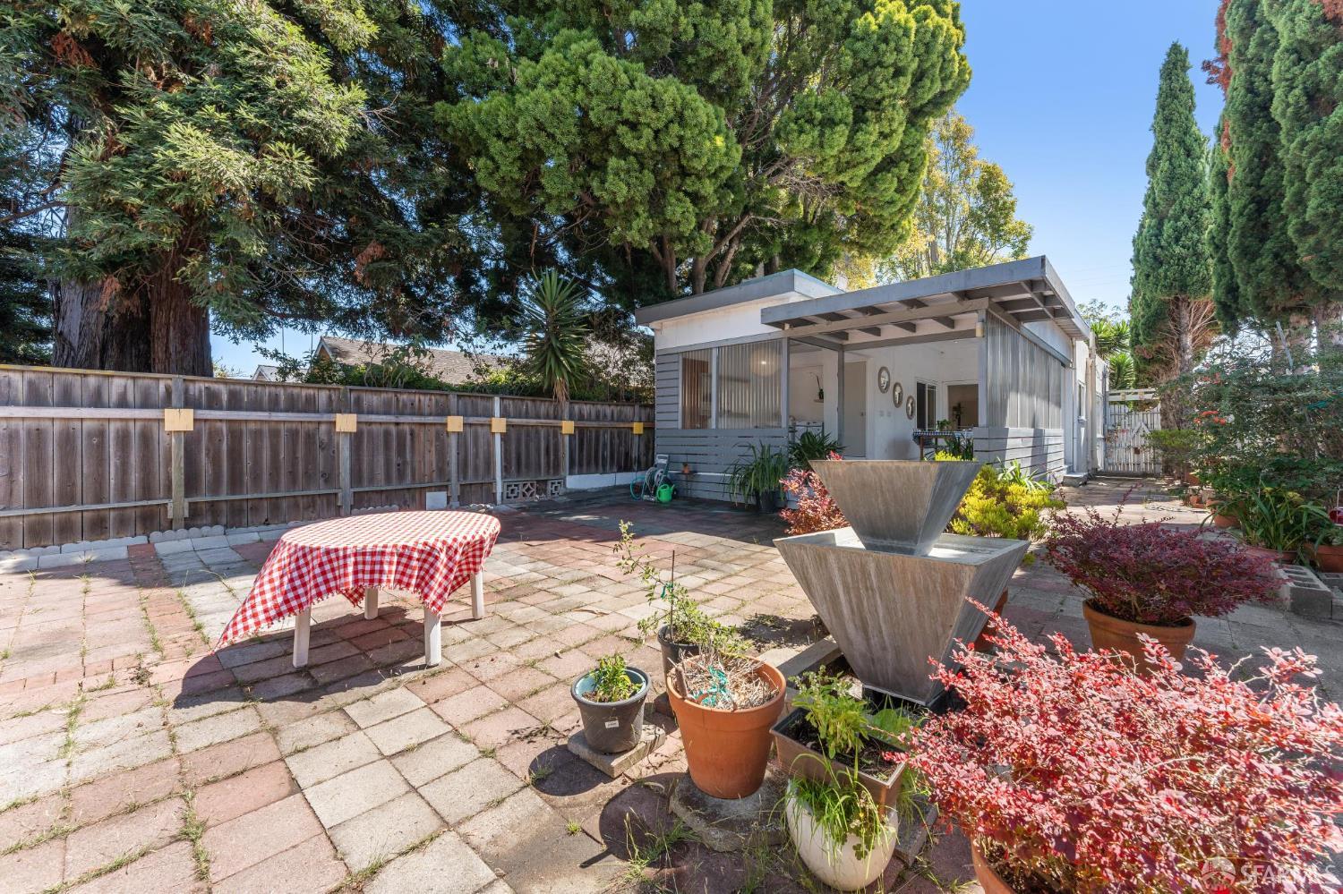 1109 Channing Way Berkeley, CA 94702 - Photo 22 of 24 a view of a patio with couches chairs and wooden fence