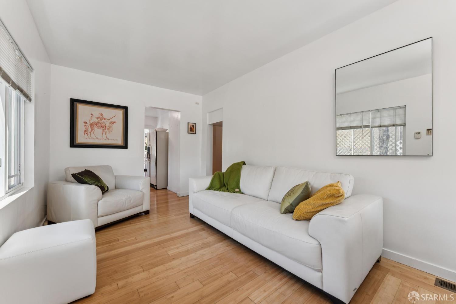 1109 Channing Way Berkeley, CA 94702 - Photo 5 of 24 a living room with furniture and a couch