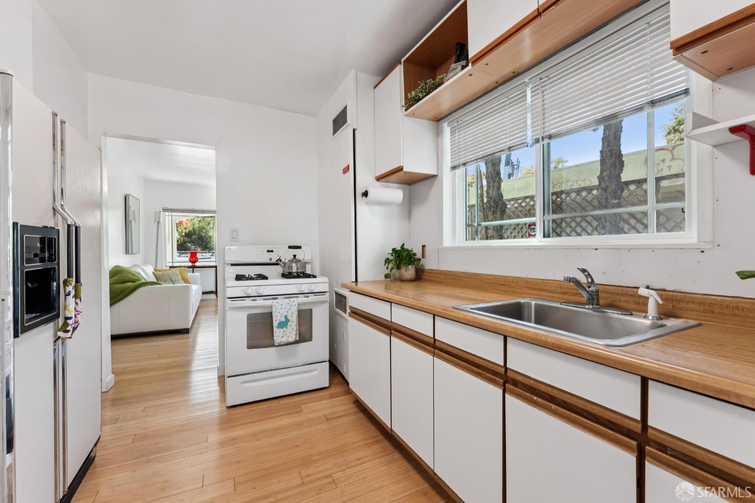 1109 Channing Way Berkeley, CA 94702 - Photo 7 of 24 a kitchen with a sink stove and cabinets