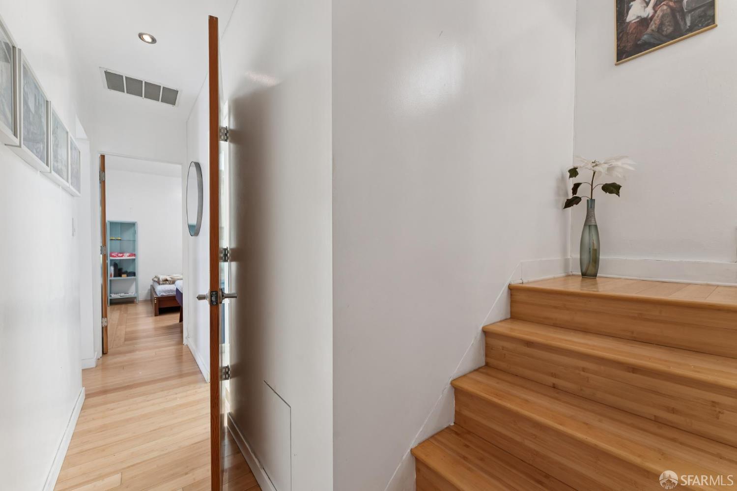1109 Channing Way Berkeley, CA 94702 - Photo 10 of 24 a view of a hallway with wooden floor and staircase
