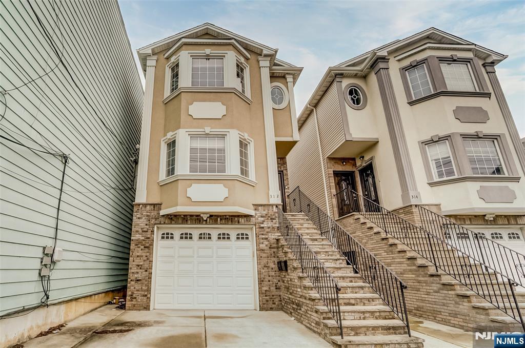 a view of a brick building with many windows