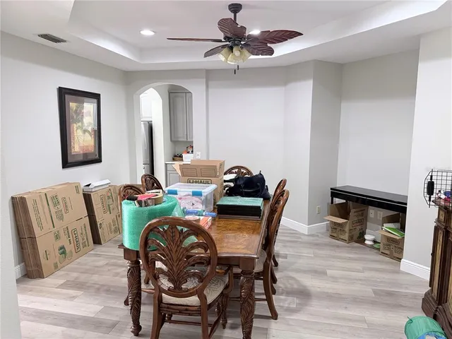 a view of a dining room with furniture and wooden floor