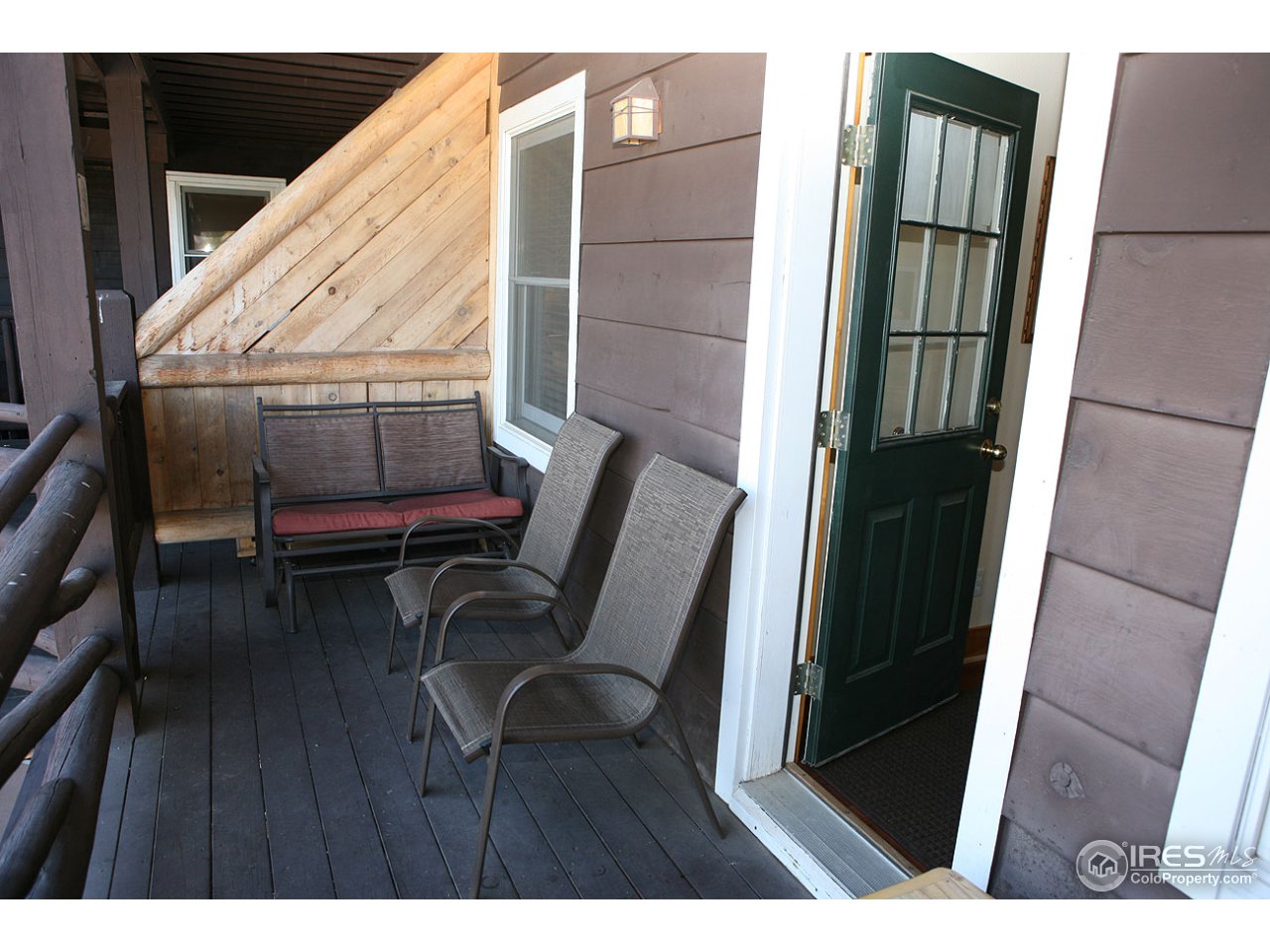 2625 Marys Lake Road, Unit 101 Estes Park, CO 80517 - Photo 17 of 25 a balcony with chairs and wooden floor