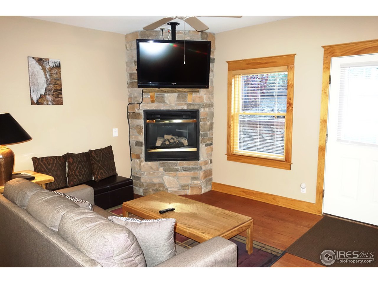 2625 Marys Lake Road, Unit 101 Estes Park, CO 80517 - Photo 23 of 25 a living room with furniture and a flat screen tv
