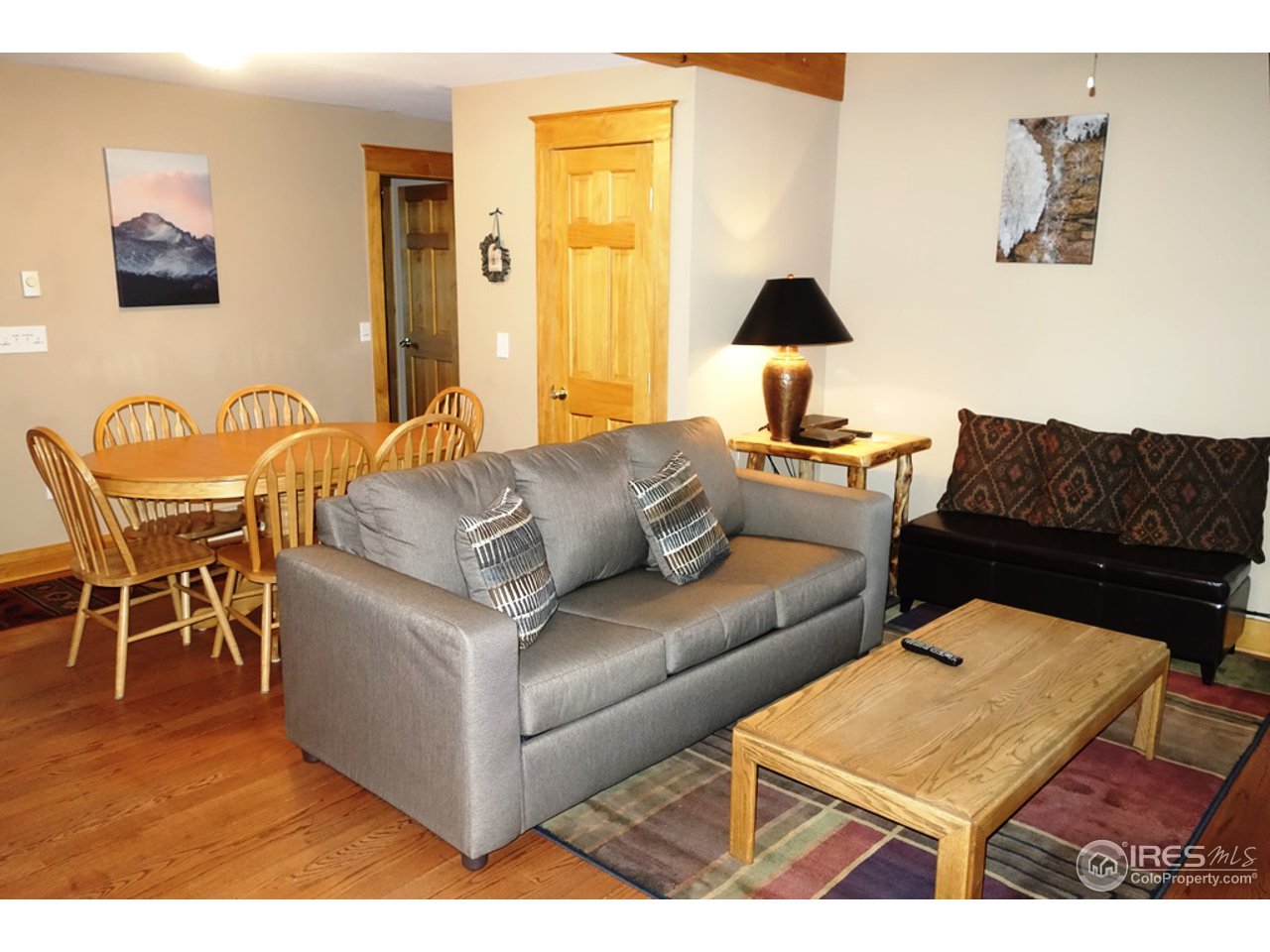 2625 Marys Lake Road, Unit 101 Estes Park, CO 80517 - Photo 6 of 25 a living room with furniture and a table