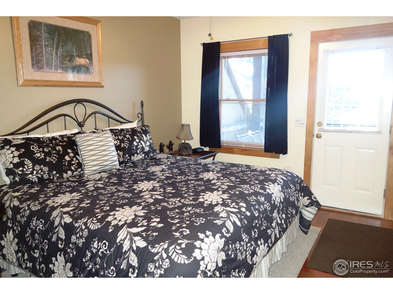 2625 Marys Lake Road, Unit 101 Estes Park, CO 80517 - Photo 8 of 25 a bedroom with a bed and a window