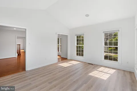 a view of staircase with white walls and a next to a window