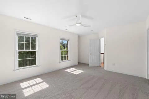 an empty room with a empty space and window